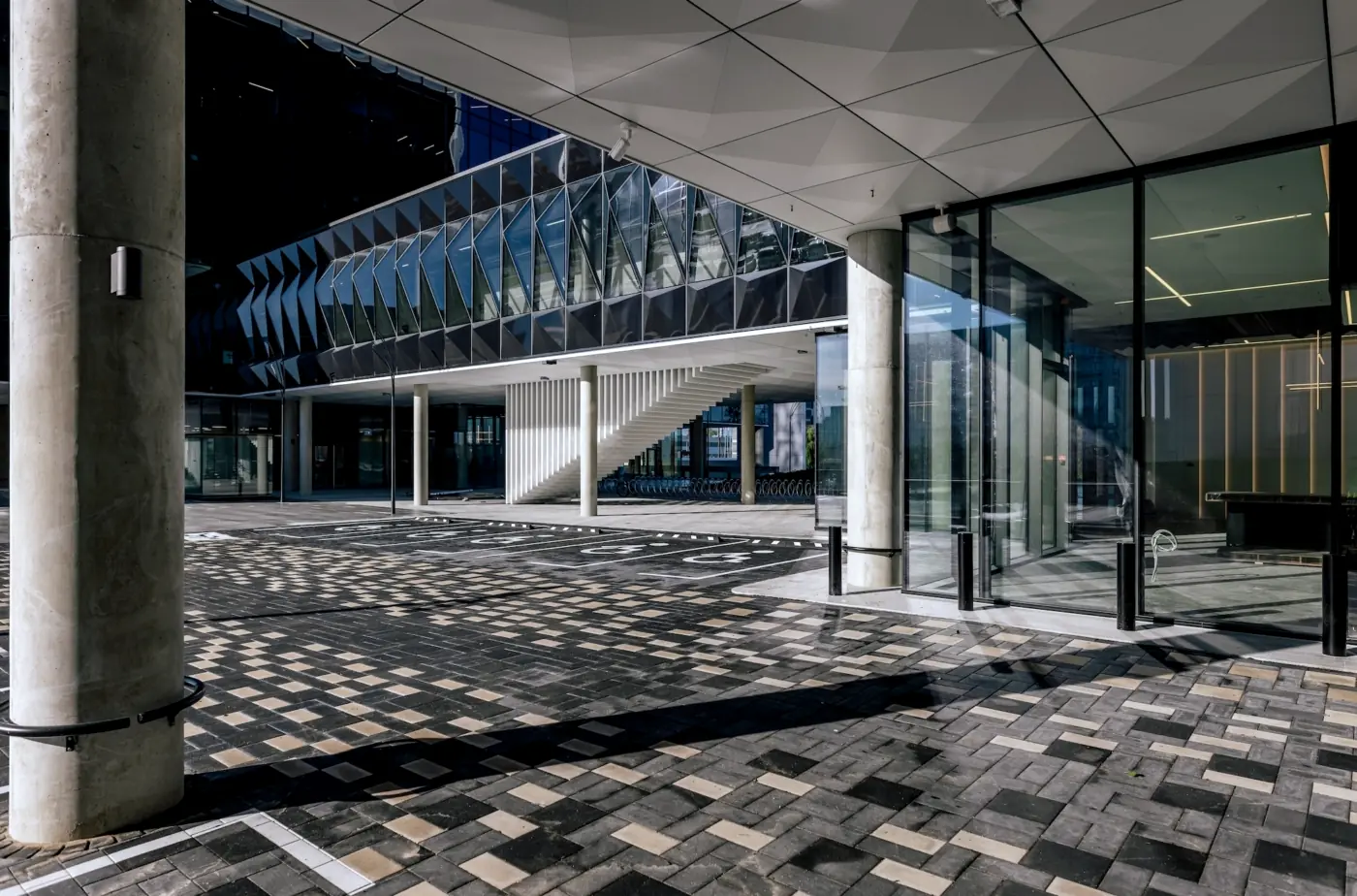 Nordic-Baltic office building exterior, glass and stone facade, Riga
